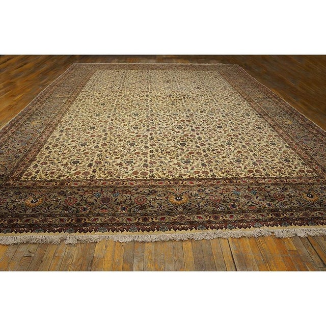 This is a majestic Antique Tabriz rug from Iran, dating to approximately 1940. It is a premier example of Formal design,...