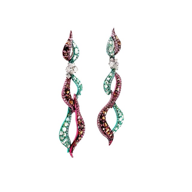 A unique and special pair of colorful earrings! They are made in 18k white gold with both green and vivid pink rhodium...