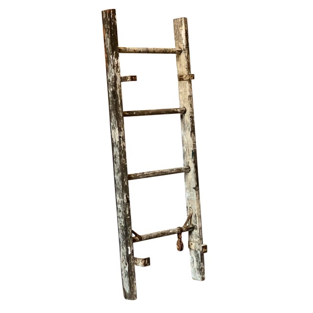 Antique rustic primitive wood ladder, c. 1910-1920. Charming, weathered ladder with original paint in shades of white and...