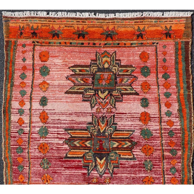Measures: 3'9 x 5'9 Vintage Caucasian Kazak Rug with Tribal Medallions in Pink and Orange 3'9 x 5'9. Keivan Woven Arts/...