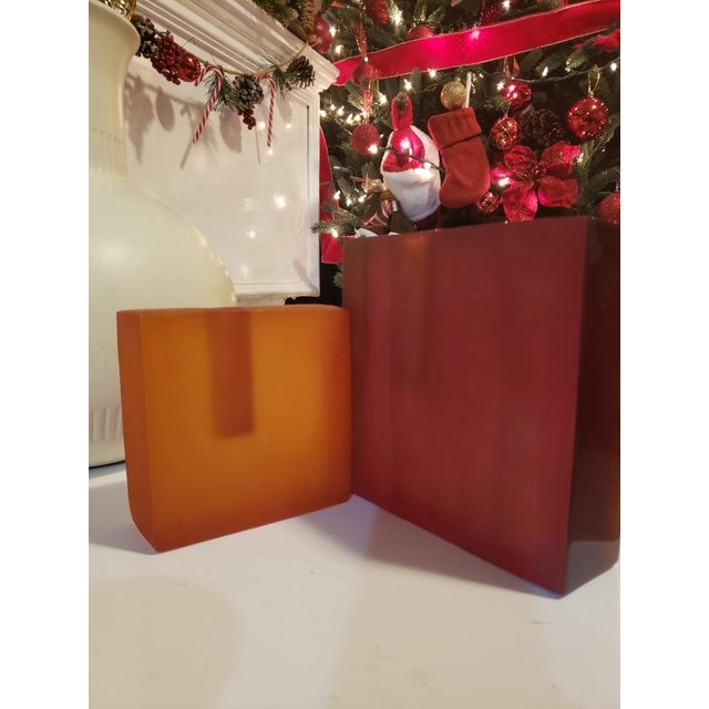 These two beautiful candleholders are made of resin .From Lawrence Essentials NY; this pair is a unique find. The dark...