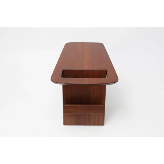 Walnut side table was designed by Jens Risom in 1949. Fantastic angular profile is sleek and modern. Wedge-shaped top...