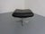 Ottoman in black leather and aluminum frame from the 1960s.