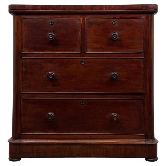 A handsome and well-crafted 19th-century English Victorian chest of drawers, beautifully constructed in mahogany and...