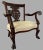 3-piece antique parlor set includes a 2-seat settee, one upholstered back arm chair and one carved wooden back arm chair....