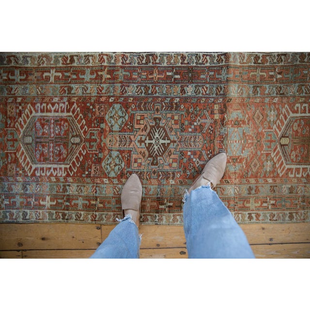 :: Single column alternating shaped medallions with hook and latch and germinating plant design motif atop a covered field...
