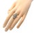 This lovely Art Deco ring is crafted from platinum. The front has an elongated shape with scallop edge on both ends. The...
