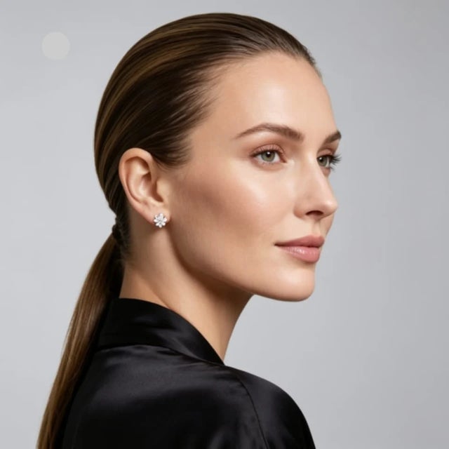 Metal: 18K White Gold Stones: Round & Baguette Diamonds 1.3 CTW Design: 6-Petal Floral Flower Stud Diameter: 0.50 inch...