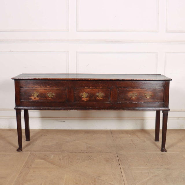 Pretty Englihs pine 3 drawer dresser base. Very good patinated colour. 1760 This piece is designed in the style of the...