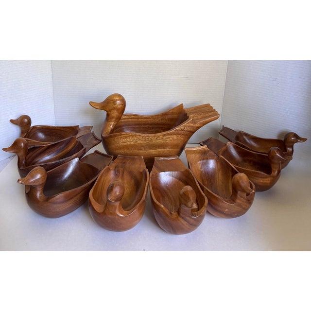 This charming mid-century nine-piece salad bowl set is beautifully hand carved in the form of ducks, capturing the playful...