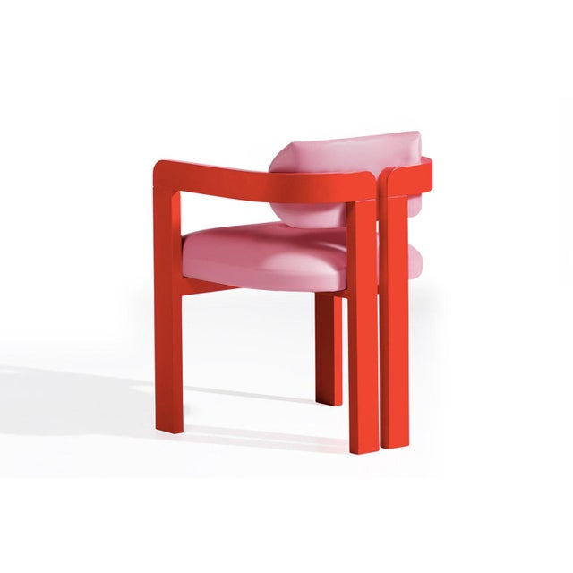 Vértigo Dining Chair in Pink Velvet with Red Legs. The Vértigo Dining Chair captures the tension between chaos and...