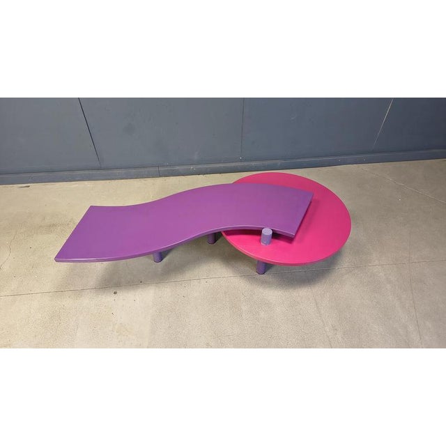 Postmodern rotating coffee table with purple and pink lacquered table tops and steel legs. Designed by Maurizio Salvato...