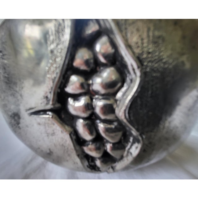 A highly collectible, sculptural mid-century novelty ice bucket in the shape of a pomegranate, designed by the iconic...