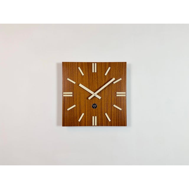 Wall clock, model PPH 410, produced by Pragotron in former Czechoslovakia during the 1980s. It features a brown wooden...