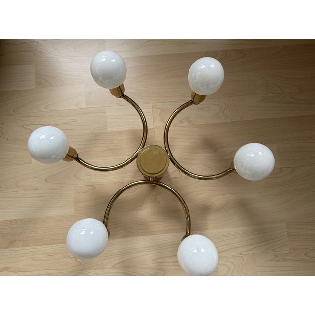 Introducing a vintage treasure from the 1980s, straight from Germany - the Gold Metal Ceiling Lamp. This exquisite piece...