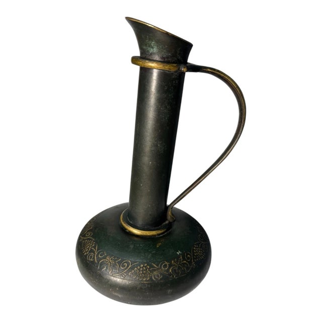 This vintage bronze/brass ewer is a beautiful piece that will enhance any collection. Crafted in Israel and handmade with...