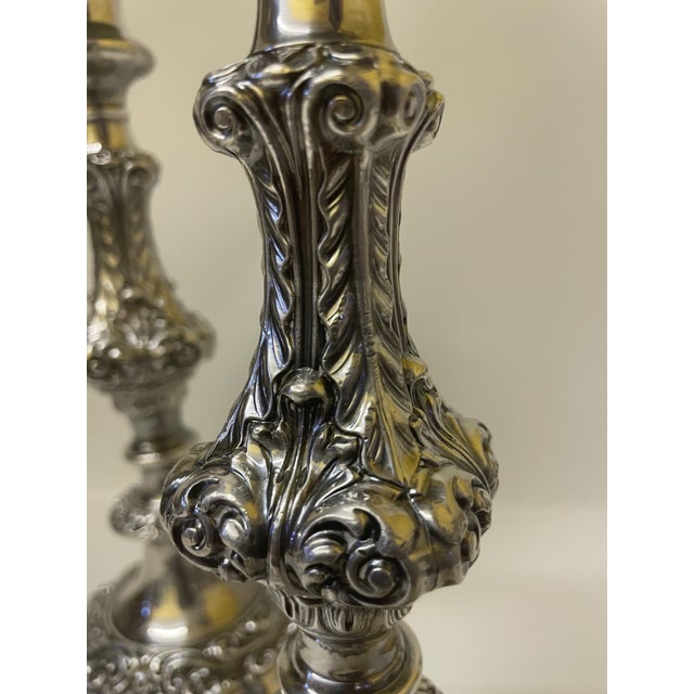 Add a touch of timeless elegance to your tabletop with this stunning, factory-matched pair of vintage silver-plated...