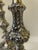 Add a touch of timeless elegance to your tabletop with this stunning, factory-matched pair of vintage silver-plated...