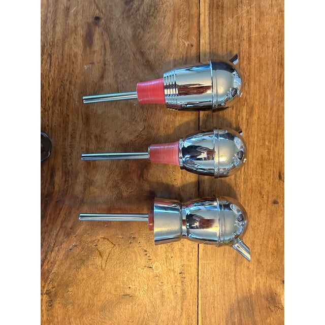 Vintage mid century modern set of three pourers. They fit onto any liquor bottle opening and pour exactly one ounce of...