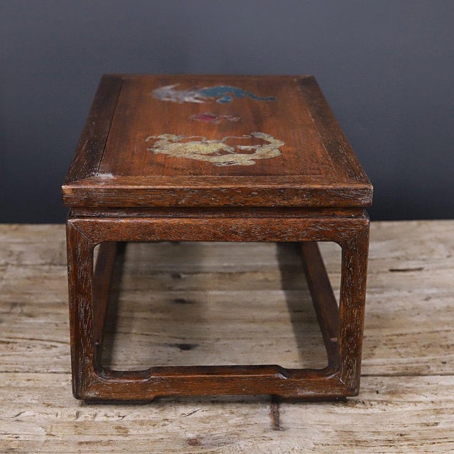 This vintage low table is crafted from African rosewood, valued for its warm honey-brown tone and striking grain. The...