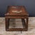 This vintage low table is crafted from African rosewood, valued for its warm honey-brown tone and striking grain. The...