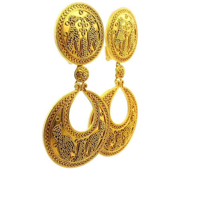 Striking 18K gold drop earrings by renowned Greek goldsmith Ilias Lalaounis, celebrated for reviving ancient Greek and...