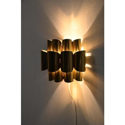 Werner schou wall sconce, designed for danish manufacturer coronell elektro in the 1960s. This mid-century modern lamp...