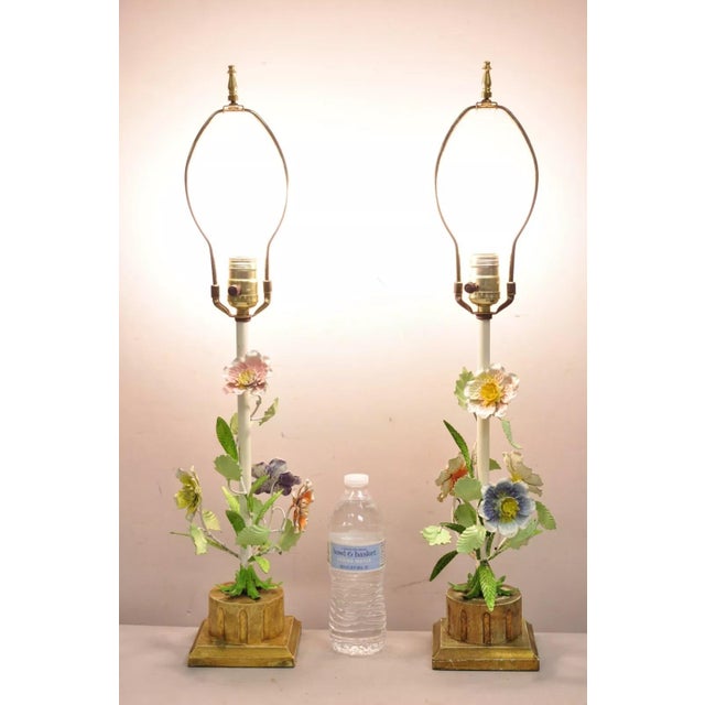 Vintage Italian Hollywood Regency Hand Painted Flowers Iron Toleware Boudoir Lamps With Distressed Gold Gilt Wooden Base....