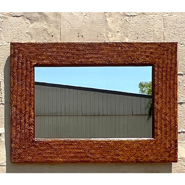 Capture coastal vibes with our Vintage Coastal Chevron Weave Rattan Horizontal Mirror. American-crafted with a distinctive...