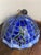 Magnificent stained-glass style pendant light. Circular lampshade, tinted glass in shades of light and dark blue, upon...
