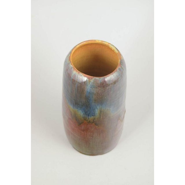 European studio ceramicist Unique vase, 1960. Slender upright vase in stoneware with a glossy, layered glaze in muted...