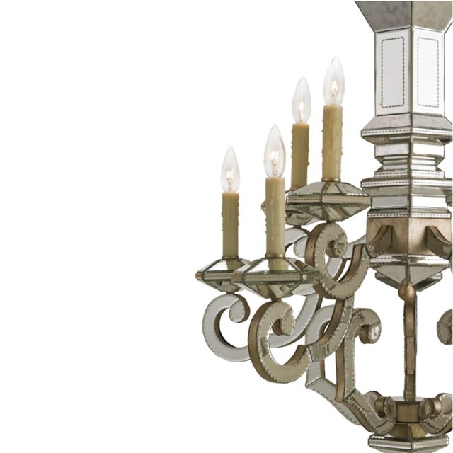 An elegant 8-light chandelier by Currey & Company, model 9219, crafted with a sculptural frame combining lightly antiqued...