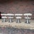 Exceptional vintage Mid-Century Modern dining set featuring a sculptural pedestal dining table with smoked glass top and...