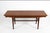 Teak coffee table with (2) leaves stored within table. Top elevates. Unmarked, attributed to Kai Kristiansen. Denmark,...