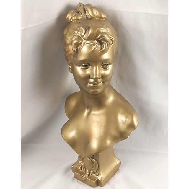A striking vintage gilt composition bust titled "Lys" (The Lily)," after the celebrated French sculptor Emile Pinedo...