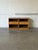 This matching set of nightstands features clean architectural lines, open display cubbies, and smooth pull-out drawers....