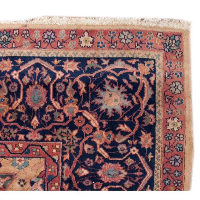 A late 19th century Indian Agra rug with an intensely woven landscape of Cyprus and flowering trees, with an all-over...
