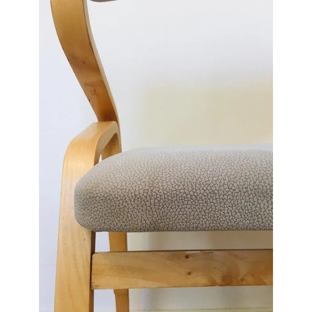 Base is made of plywood, in original condition, has been refreshed with oil and wax. Seat was reupholstered with eco...