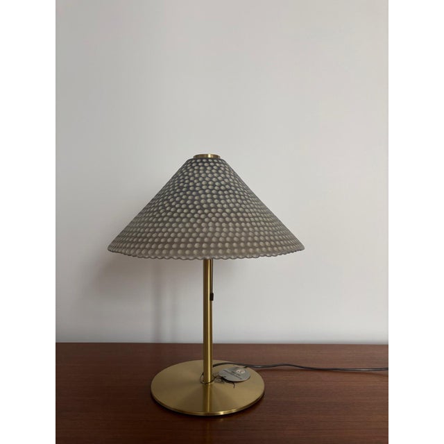 Beautiful brass table lamp with a glass shade by Peill & Putzler from the 1970s. The light has two adjustable settings:...