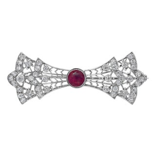1930s Platinum and White Gold Diamond Bow Brooch With Burma Ruby Center For Sale