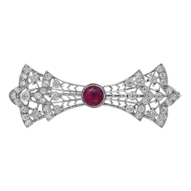 1930s Platinum and White Gold Diamond Bow Brooch With Burma Ruby Center For Sale