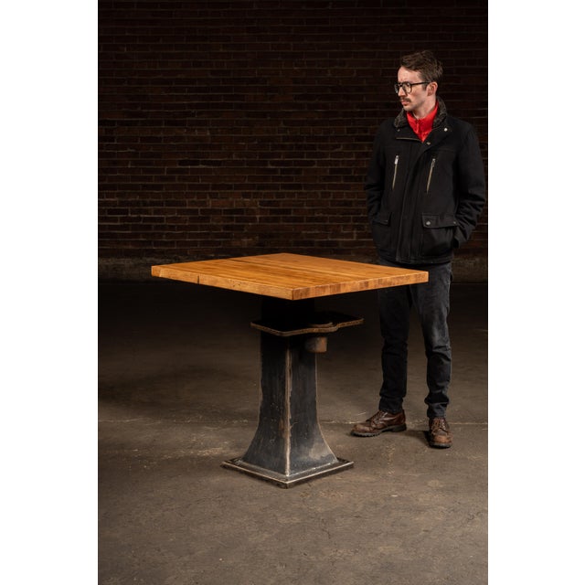 Square maple work surface mounted to a flared cast-iron machine pedestal with an optional bolt-on tray assembly. Built...