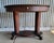 An oval library table / desk from the "Golden Oak" era of American furniture design. Made with quarter-sawn, often called...