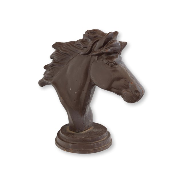 Power meets poise in this cast iron horse head sculpture, finished in its original rich brown paint. The finely modeled...
