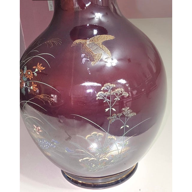This vintage Japanese vase features a stunning gold trim design with a beautiful pheasant bird and flowers. Measuring at...