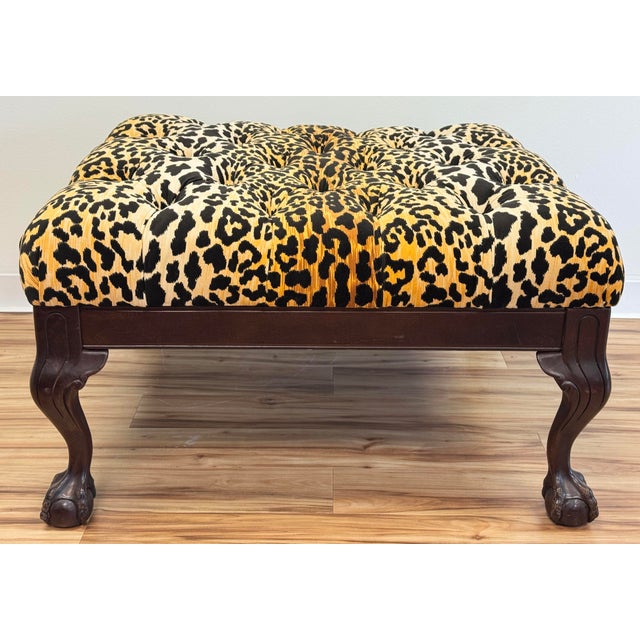 Vintage carved claw foot ottoman with new tufted leopard print velvet upholstery. Features prominent claw or talon and...