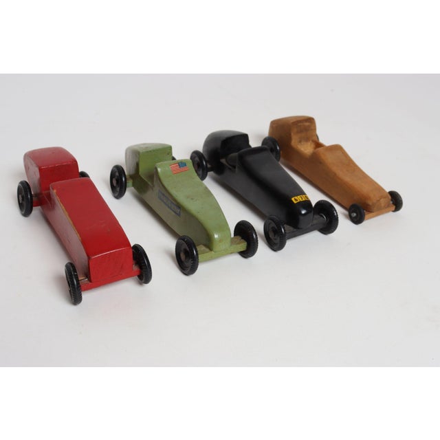 Circa late 1950s / early 1960s Pinewood Racers, which, since 1953, were sold as blocks of wood with accessories for boy...