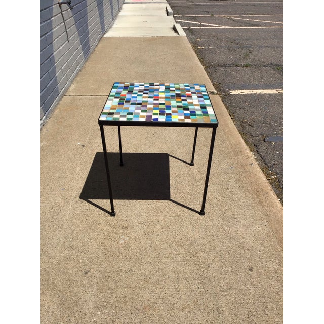 A playful blend of modernist form and artisanal craftsmanship, this vintage mosaic side table brings bold color and...