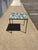 A playful blend of modernist form and artisanal craftsmanship, this vintage mosaic side table brings bold color and...