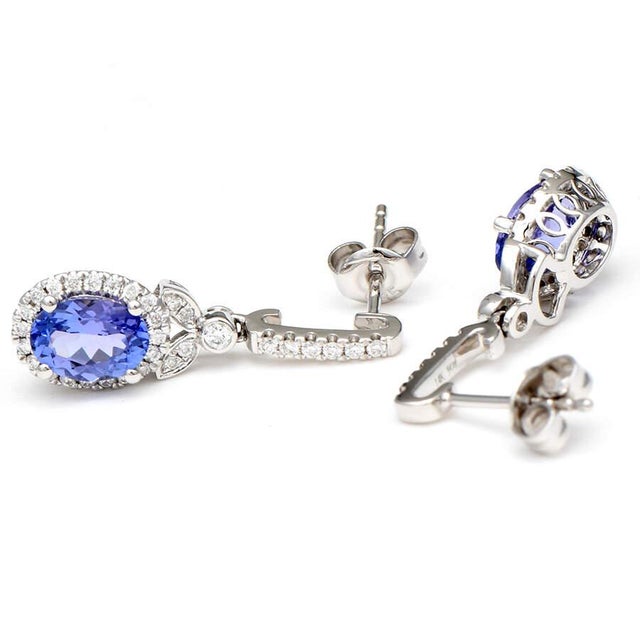 Flawless and feisty, this show-stopping pair of earrings will be the talk of the town. Tanzanite and diamonds drip down...